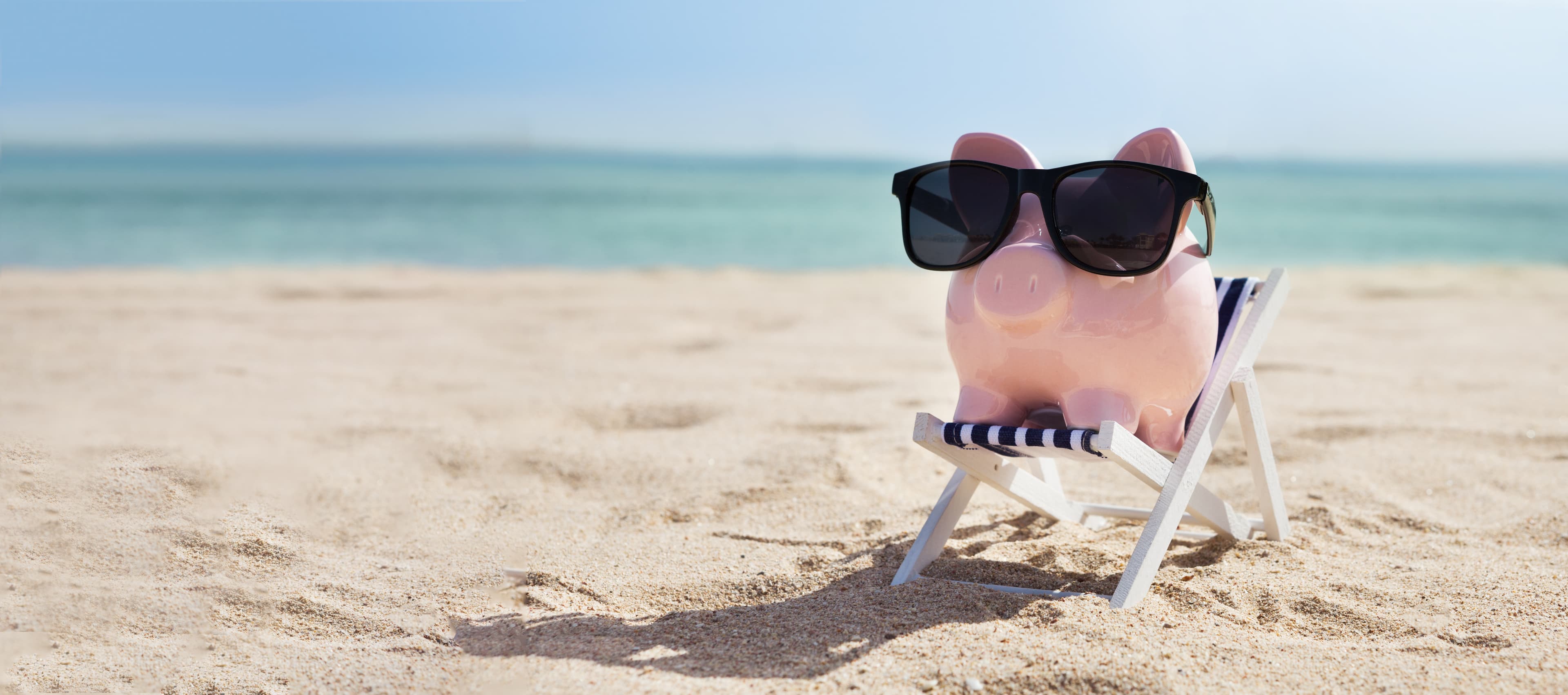 A piggy banch in a lounge chair on a beach