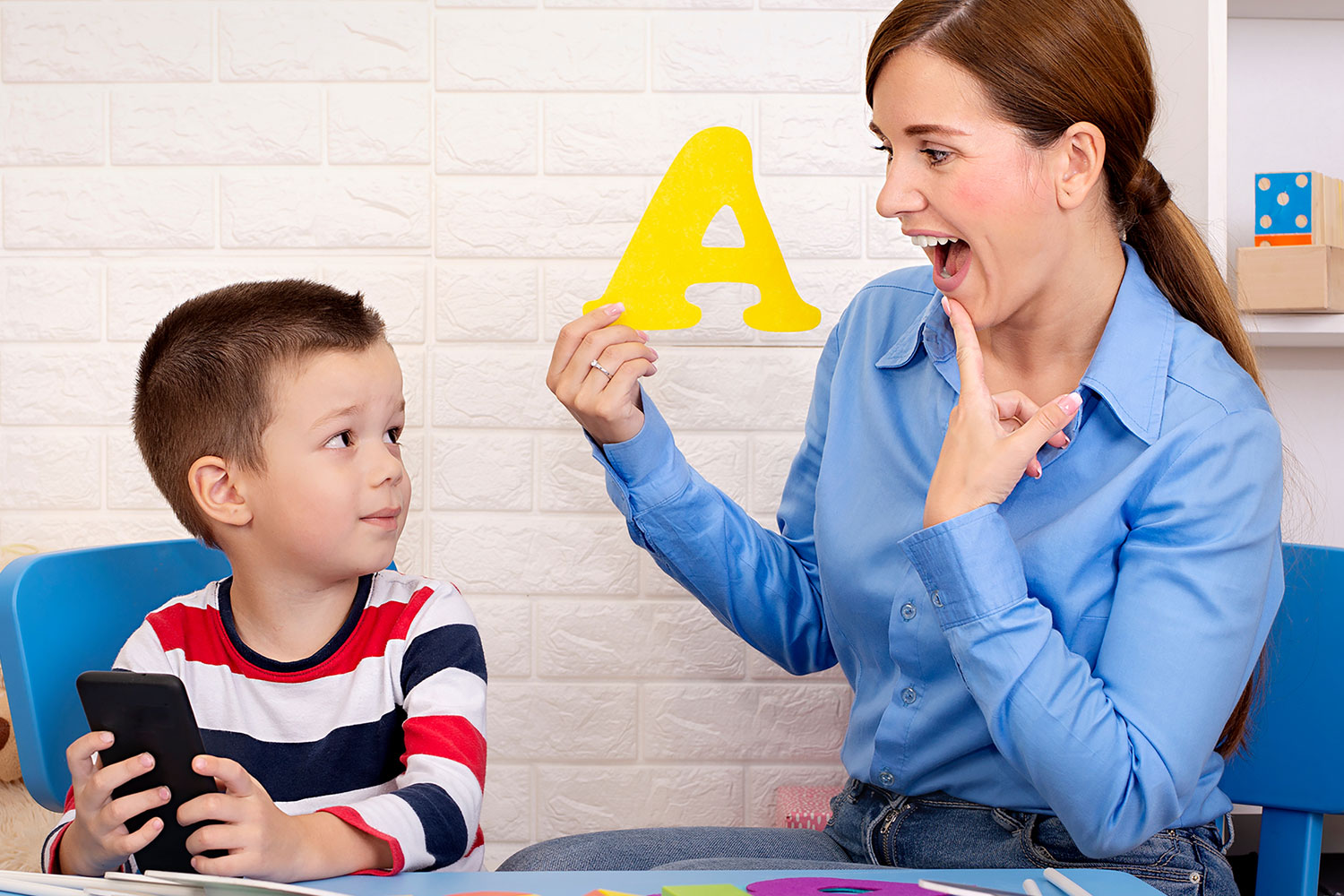 Licensed therapist at work with student