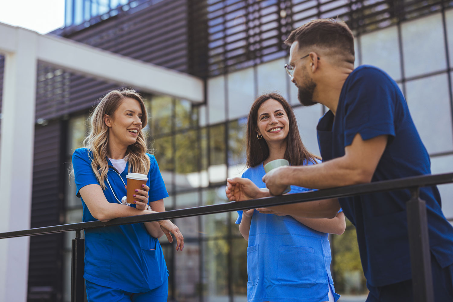 Three therapists chatting about pay and salary