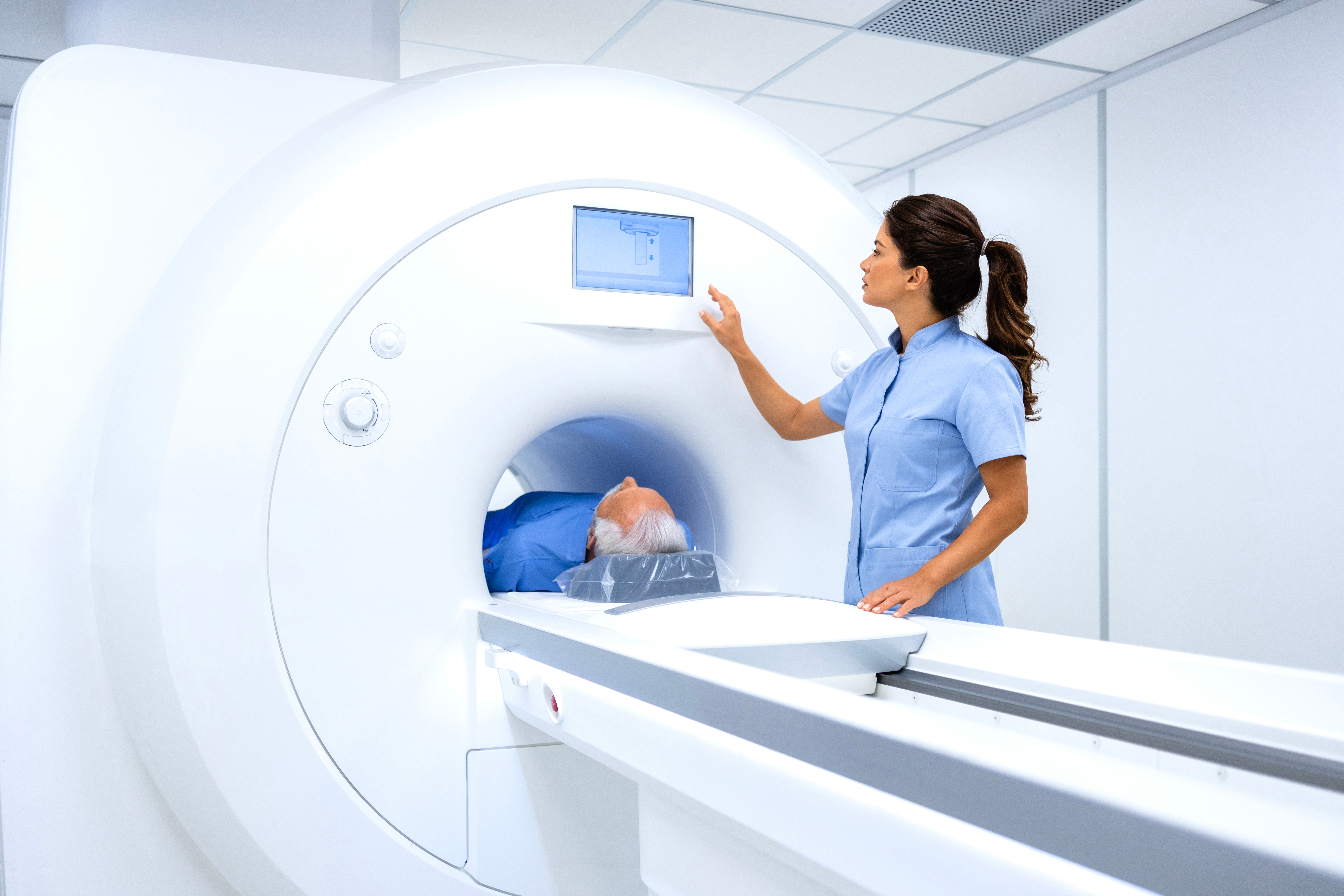 MRI Tech preparing patient for scan