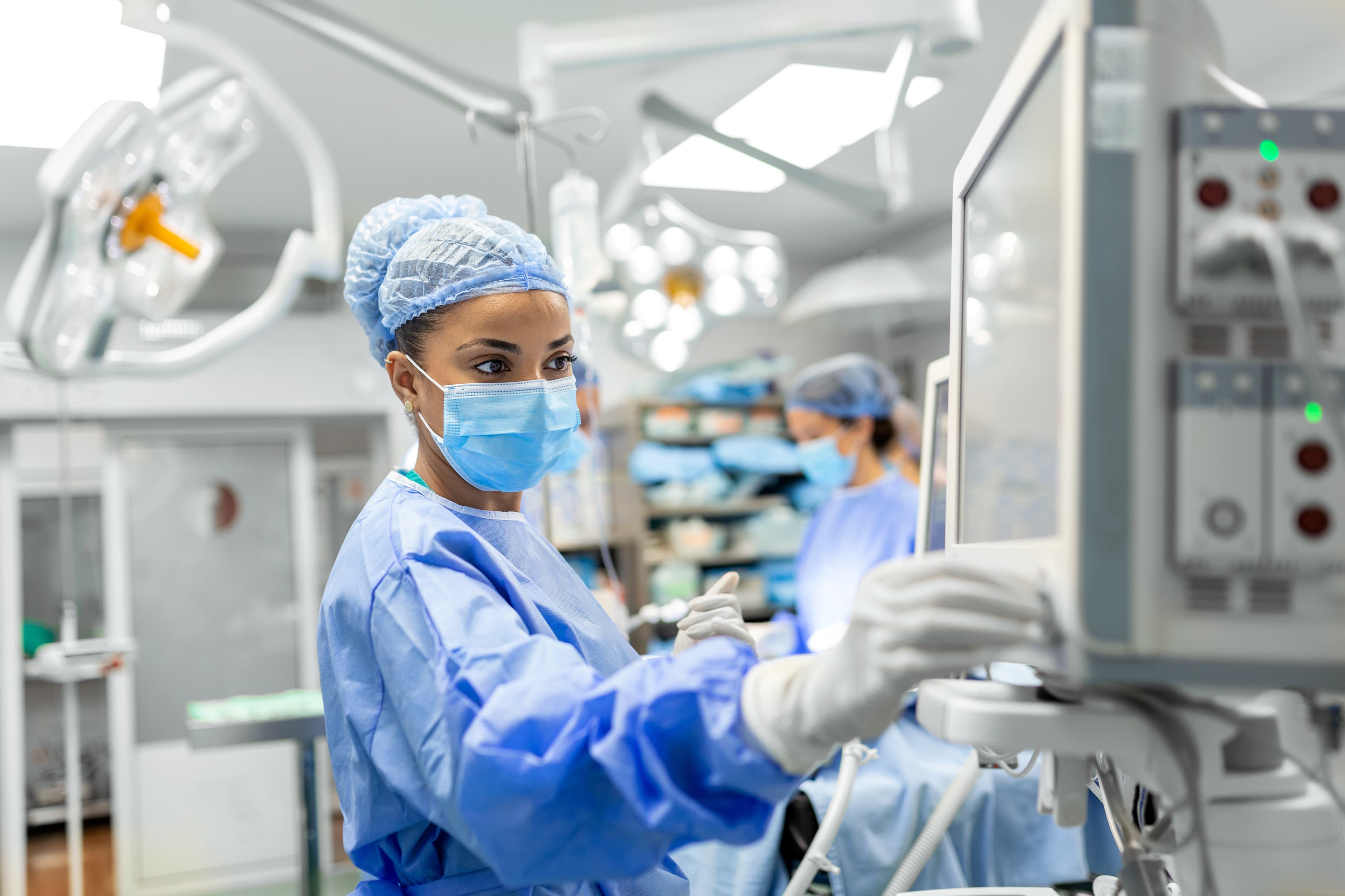 Anesthesiology nurse checking monitor