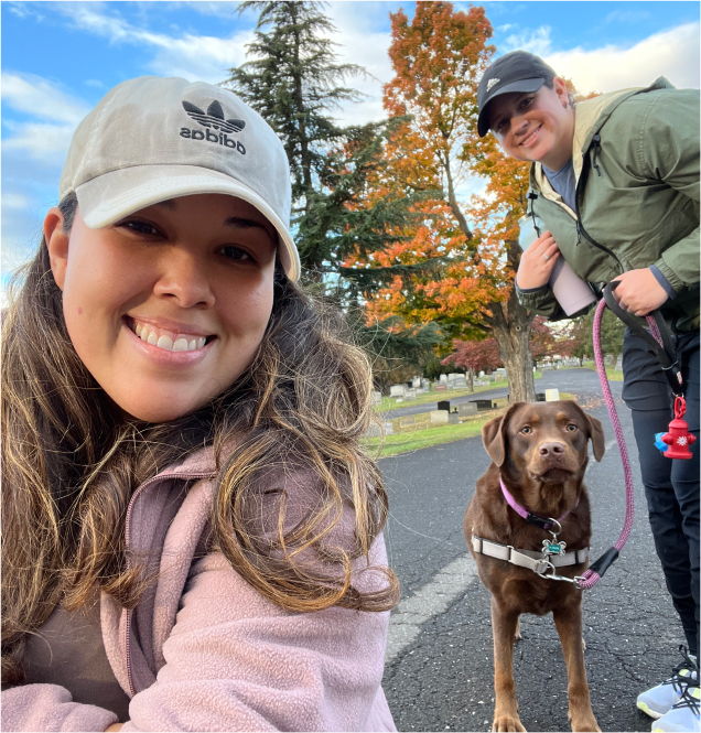 Two RNs taking their dog out for a walk