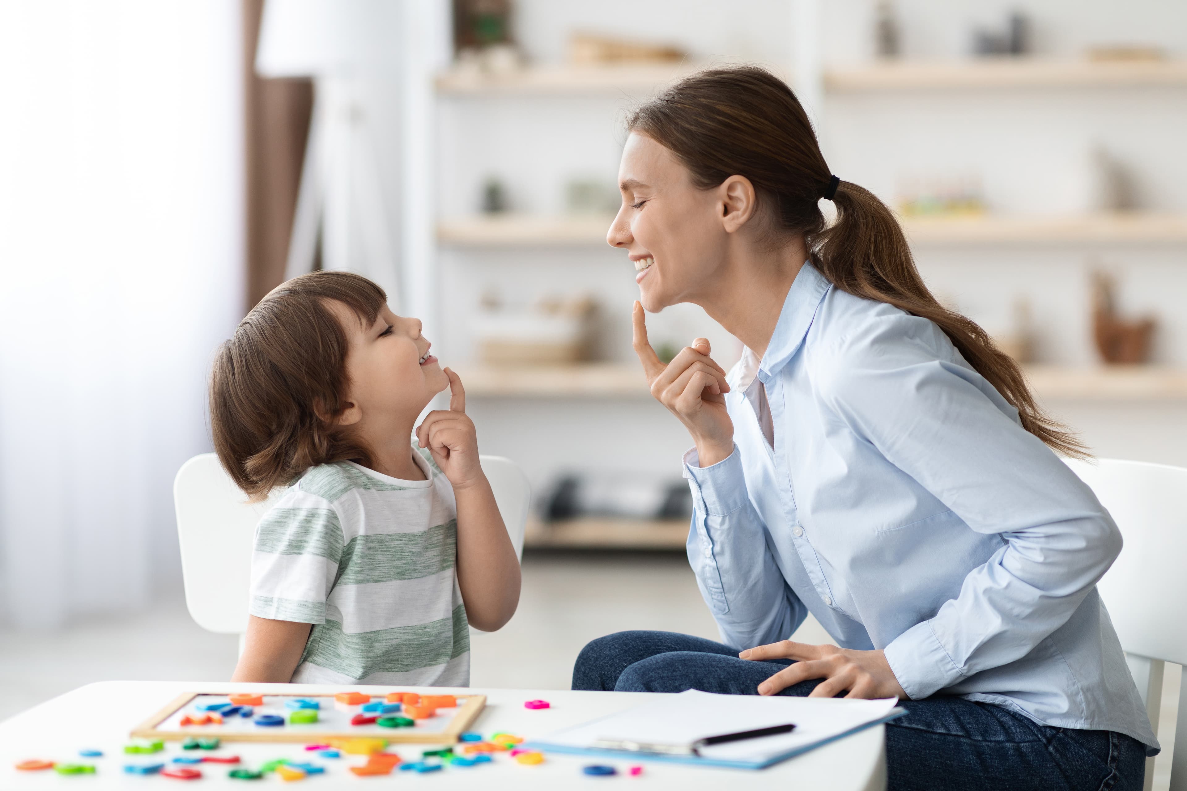 Speech therapist playing with a patient