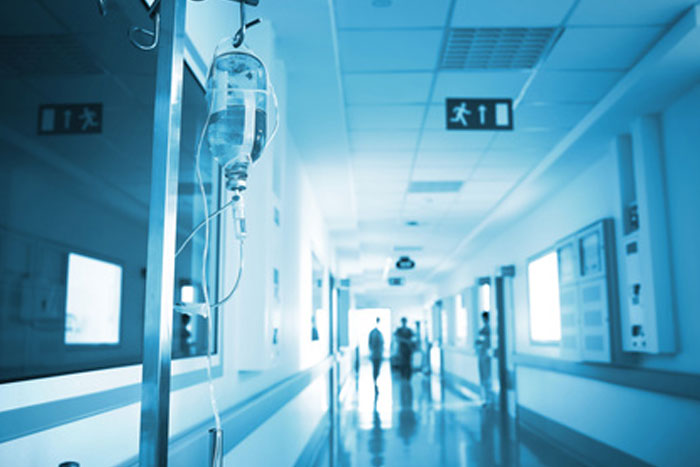 RNs in dim hallway for night shift nursing