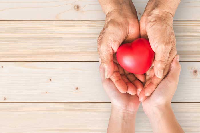 Nurse and patient hands show impact of RNs on patients lives