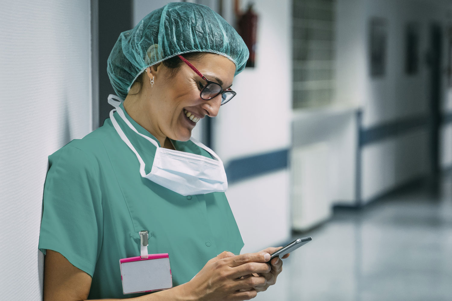 Travel nurse reading news on mobile phone