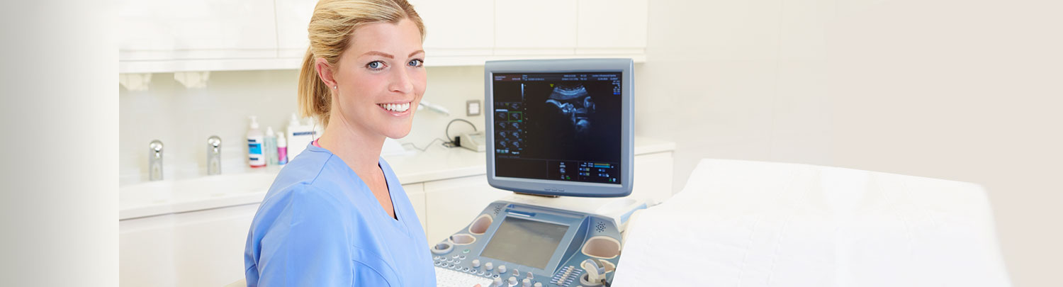 Ultrasound tech on scanning machine